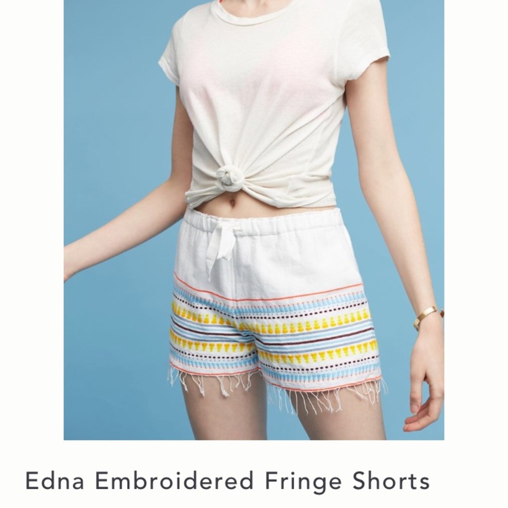 Anthropologie embroidered fringe shorts.